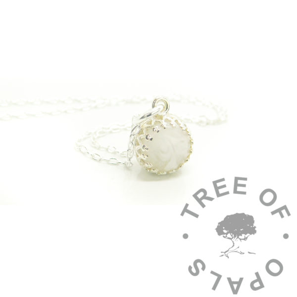 breastmilk necklace in 8mm round crown point setting in solid silver, no colour or sparkle, shown on 1.3mm chain