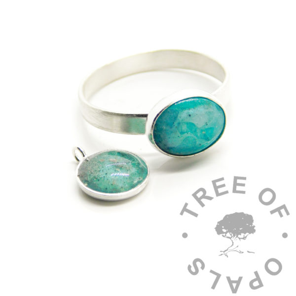 blue lagoon ring and necklace, teal inks - cremation ashes in resin with alcohol inks in green, teal and aqua with white. 10x8mm oval bezel cup with stone in a rubover setting, in solid anti-tarnish silver and 8mm bezel cup pendant. Cremains jewellery for cremation ash handmade