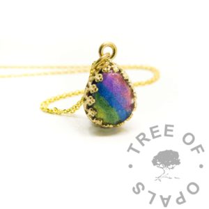Gold Hair Teardrop Necklace Gold Ash Teardrop Necklace solid gold rainbow ash teardrop, solid 9 or 14ct yellow gold hallmarked, photo mockup. Cremation ashes in resin with rainbow sparkle mix colours. Solid gold crown point open back necklace setting shown with chain upgrade, 10x8mm teardrop setting
