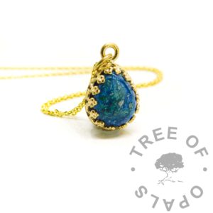 Gold Ash Teardrop Necklace solid gold blue ash teardrop, solid 9 or 14ct yellow gold hallmarked and handmade. Cremation ashes in resin with mermaid teal and aegean blue resin sparkle mix. Solid gold crown point open back necklace setting shown with chain upgrade, 10x8mm teardrop setting