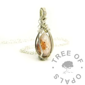 mystery piece - hand wire wrapped solid silver umbilical cord necklace. 14x10mm anti-tarnish 940 Argentium silver handmade setting. Resin baby keepsake bead with umbilical cord swirled into unicorn white resin sparkle mix in a galaxy effect