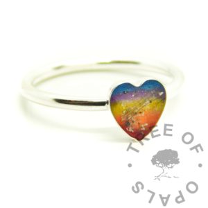 cremation ashes heart ring sunset heart memorial ring, 8mm heart handmade classic band ring. Solid silver setting with anti-tarnish silver band and UV resin with cremation ashes and two people's hair. Sunset rainbow effect with resin sparkle mix background. Perfect for memorial designs with epoxy or UV resin, cremation ashes and hair or fur, even breastmilk and umbilical cord. Memorial order from Tree of Opals artist Nikki Lovegrove