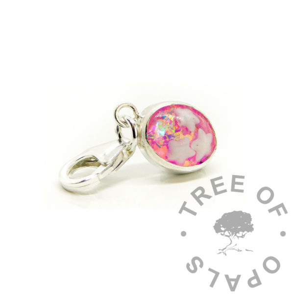 pink breastmilk dangle charm with milk stars. Solid sterling silver handmade settings. Breastmilk jewelry, breast feeding keepsake jewellery with pink holographic flecks behind teeny stars cabochon stone. 9mm carabiner clasp setting for Thomas Sabo or large link bracelet mystery piece