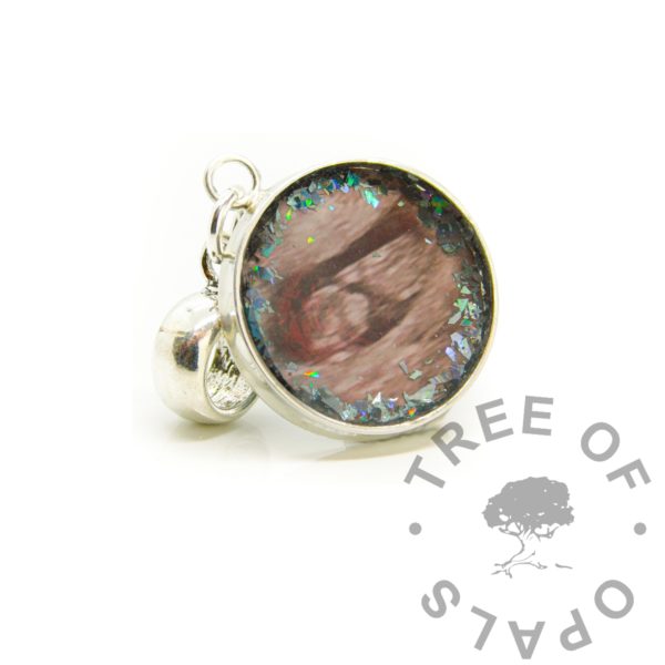 scan photo dangle charm or necklace with open backed setting. Solid silver setting with dangle charm bail suitable for European large hole bead bracelets or heavy chains. Baby memorial scan photo keepsake with platinum holographic flecks around the edge