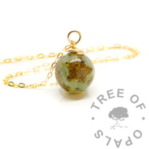 Gold Umbilical Cord Orb Solid gold umbilical cord orb. Angelic aqua umbilical cord orb necklace with cord stars made out of the umbilical cord. Made from solid 9ct yellow gold. Birth and breastfeeding keepsake jewelry. Wire wrapped by hand with 20"/50cm solid gold chain.