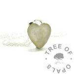 heart bezel necklace setting with pale fur and pearlescent pink. Shown with jump ring and chain. The fur was translucent and almost transparent due to lack of pigmentation so we added alcohol ink pigment in a pastel apricot colour to make the hair more visible. Solid sterling silver handmade necklace setting, not 925 stamped. Engraved on the back