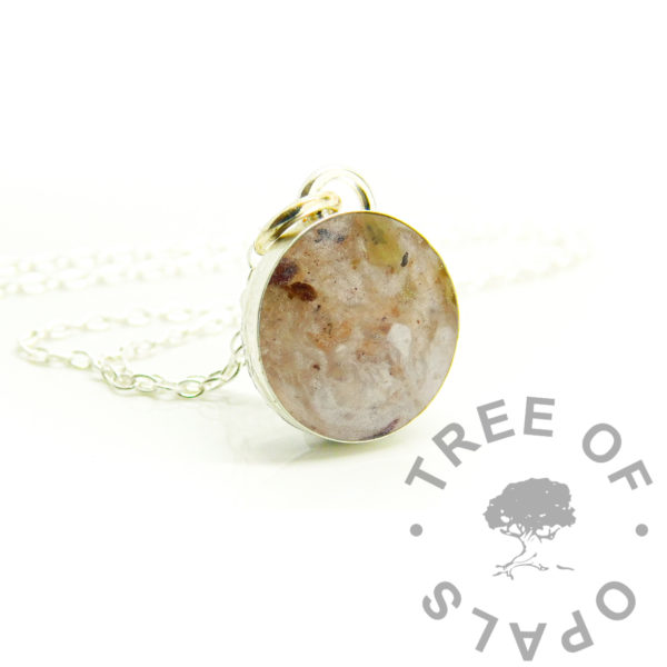Round Umbilical Cord Necklace umbilical cord breastmilk round necklace, solid sterling silver 925 jewellery. Breastmilk powder and baby's cord stump in 16mm round bezel necklace setting shown with chain. Breastmilk jewellery. Handmade baby keepsake jewelry made in the UK. Photo mockup