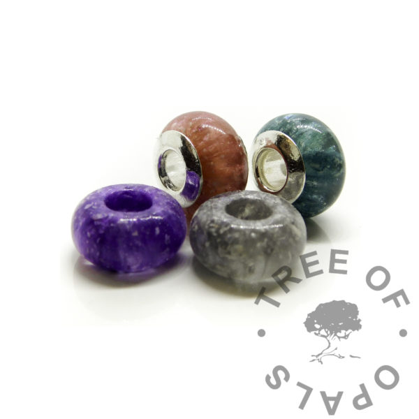 ashes beads with blank cores and without cores. Cremation ashes memorial jewellery with solid sterling silver bead cores. Medium bead 925 keepsake jewelry with dragon's blood red, mermaid teal, orchid purple and dolphin silver resin sparkle mix
