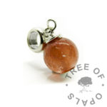 red ashes orb keyring with wire wrapped headpin. Cremation ashes memorial jewellery with solid sterling silver bead pin. 925 keepsake jewelry necklace with dragon's blood red resin sparkle mix. Shown with classic dangle charm setting for keyrings