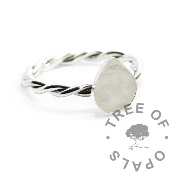 sparkly breastmilk teardrop twisted band ring. Solid silver handmade ring with teardrop shaped bezel cup for direct pour. Milk and unicorn white resin sparkle mix. 2.4mm twist wire with 8x6mm pear shape cup, breastfeeding keepsake memento