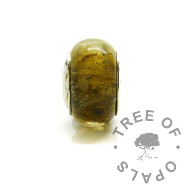 golden solid silver ashes bead, cremation ashes with goddess golden resin sparkle mix. Donut shaped bead for Pandora style bracelets set with real solid 925 silver. A memorial bracelet keepsake jewellery adult, child or pet passing away memento. Made by hand