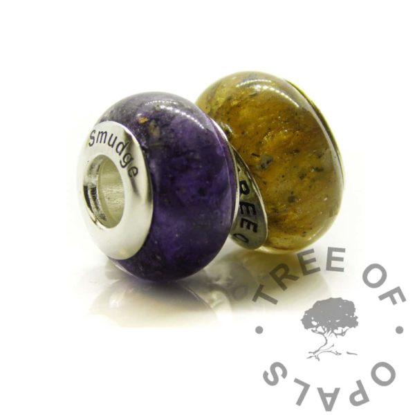 purple and golden solid silver ashes beads, cremation ashes with orchid purple and goddess golden resin sparkle mixes. Engraved with a pet's name in Arial font. Donut shaped bead for Pandora style bracelets set with real solid 925 silver. A memorial bracelet keepsake jewellery adult, child or pet passing away memento. Made by hand