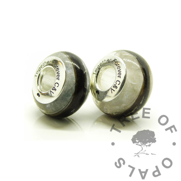 hair bead duo, two locks of hair beads for European bracelets. Solid 925 sterling silver bead core engraved with arial font. Locks of hair keepsake jewellery engraved with arial font and heart emoji. Unicorn white, angelic aqua and pearlescent blue resin sparkle mix