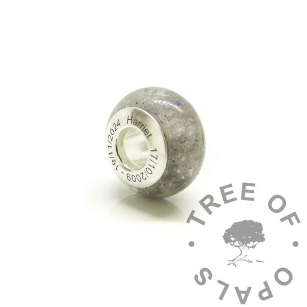pastel purple memorial bead. Cremation ashes and pastel purple sparkle. Engraved bead core with dates of birth and passing, arial font. Memorial jewellery in the UK. Solid sterling silver 925 stamped