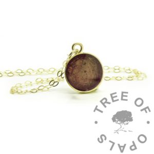 Gold Ash Necklace solid gold ashes necklace, solid 9ct yellow gold hallmarked 10mm round necklace setting. Fairy pink and tangerine orange resin sparkle mix blend. Fine weight solid gold chain included, a light sprinkling of naturally dark cremains, memorial pendant. Engravable necklace setting on the back