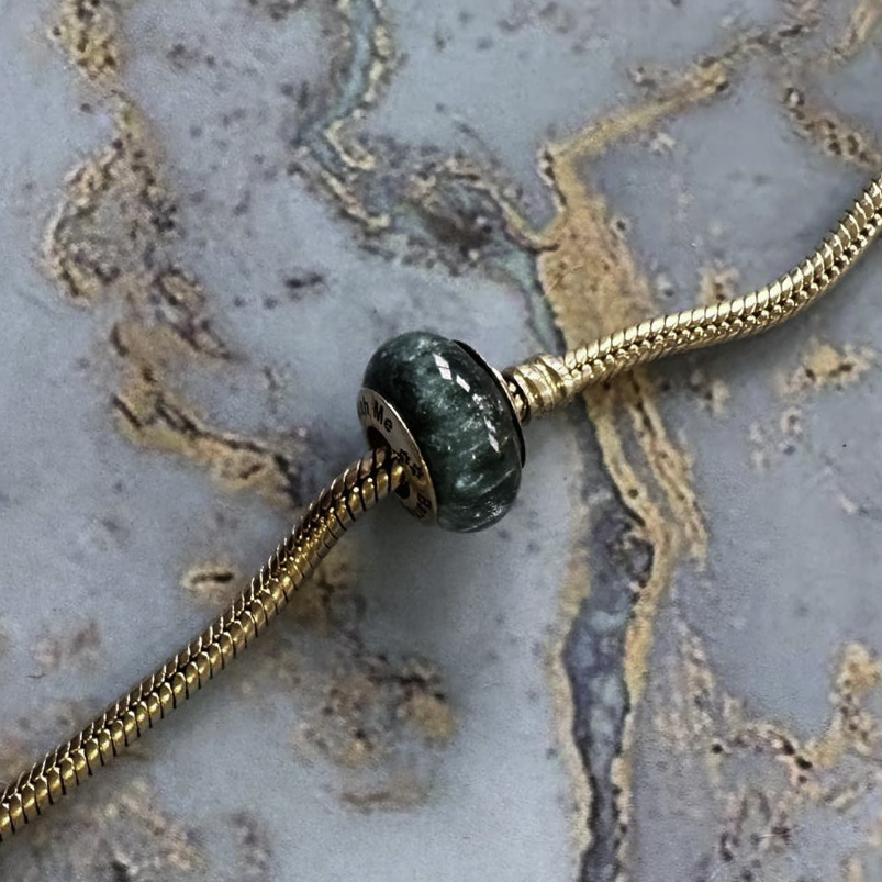 client own gold ash bead, text engraved solid hallmarked 9ct yellow gold with teal bead, client's own submission on her Pandora bracelet with permission to share, many thanks